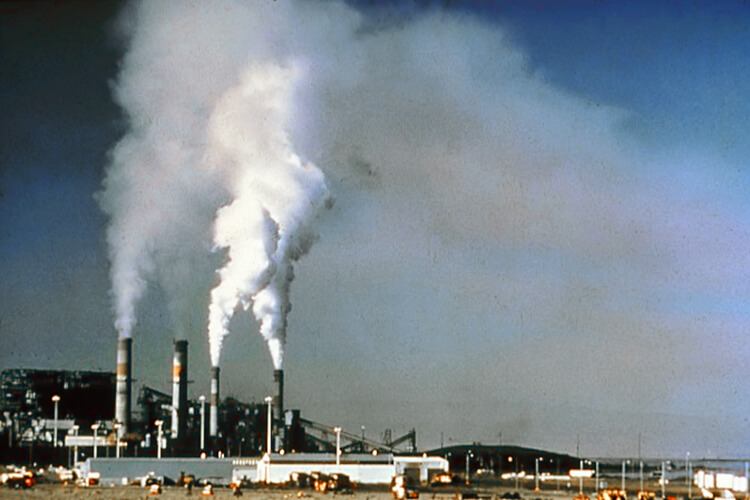 An industrial chimney. Note that this photo was taken prior to installation of emission controls equipment for removal of sulfur dioxide and particulate matter. Credit https://commons.wikimedia.org/wiki/File:Air_pollution_by_industrial_chimneys.jpg