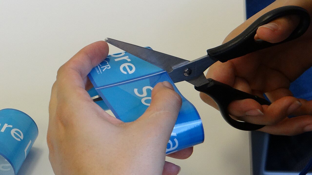 Cutting a sticker. Cutting a Free Software decal with scissors. Credit https://commons.wikimedia.org/wiki/File:Cutting_a_sticker.jpg